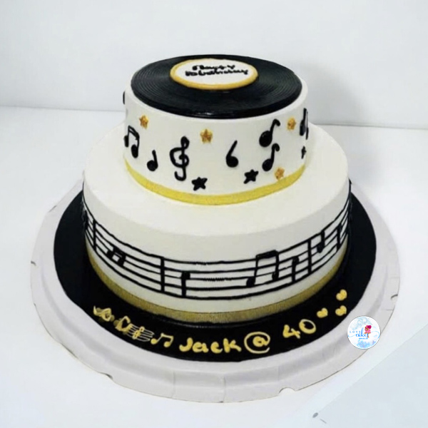 bánh kem chủ đề âm nhạc Bánh kem chủ đề âm nhạc hai tầng trang trí nốt nhạc và đĩa than đen trắng sang trọng – món quà sinh nhật cho người yêu nghệ thuật.