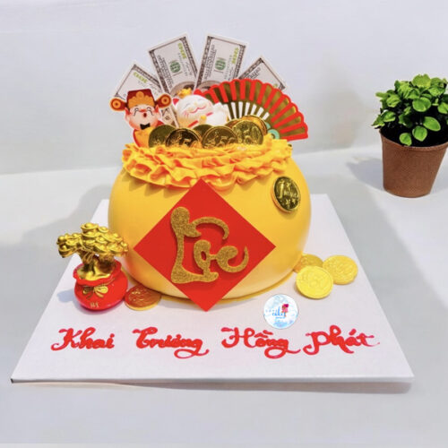 Bánh khai trương túi vàng trang trí đồng tiền vàng, tiền đô và chữ Lộc chúc mừng khai trương hồng phát